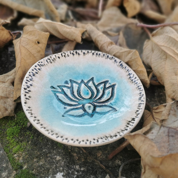 Turquoise ceramic bowl with lotus flower pattern