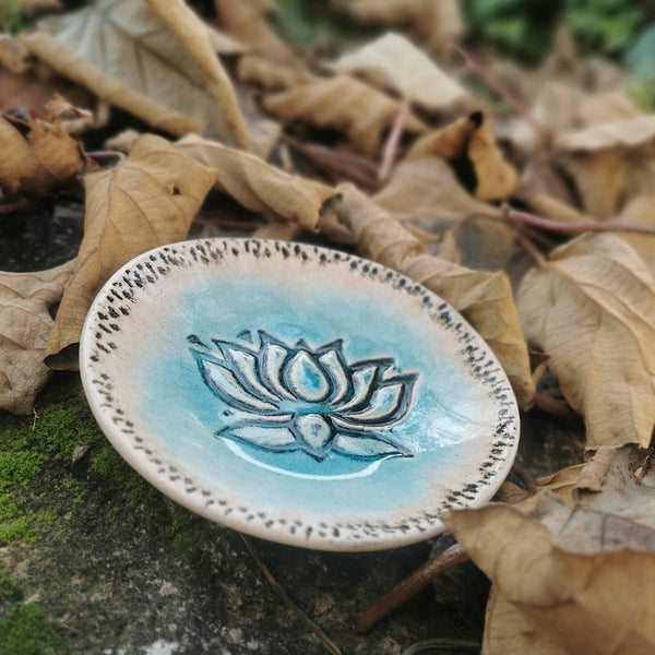 Turquoise ceramic bowl with lotus flower pattern