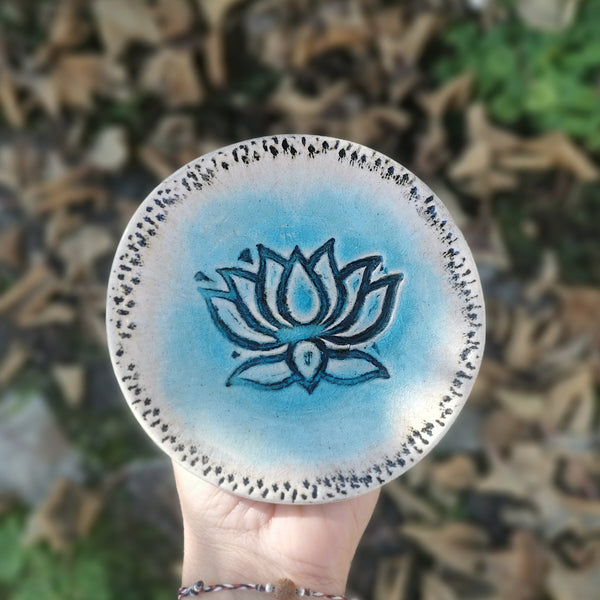 Turquoise ceramic bowl with lotus flower pattern