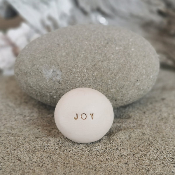 JOY - Motivational message ceramic pebble