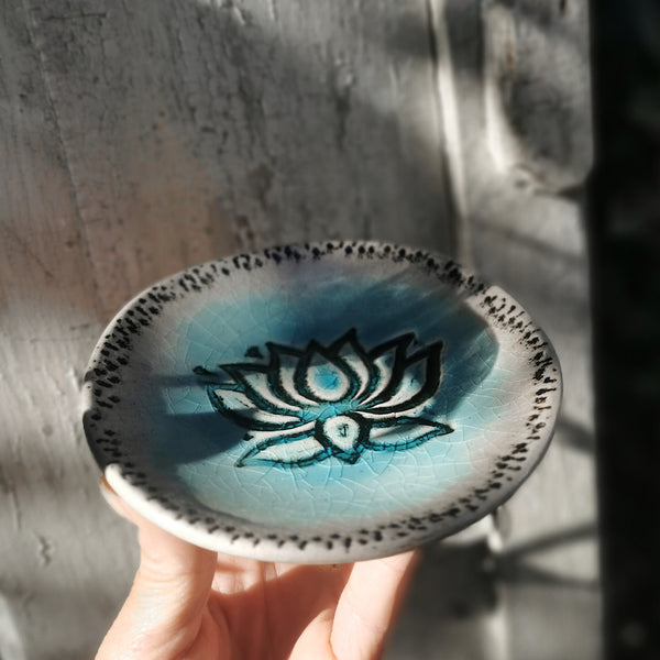 Turquoise ceramic bowl with lotus flower pattern