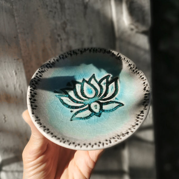 Turquoise ceramic bowl with lotus flower pattern