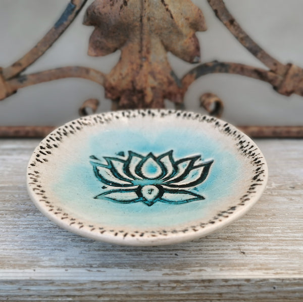 Turquoise ceramic bowl with lotus flower pattern