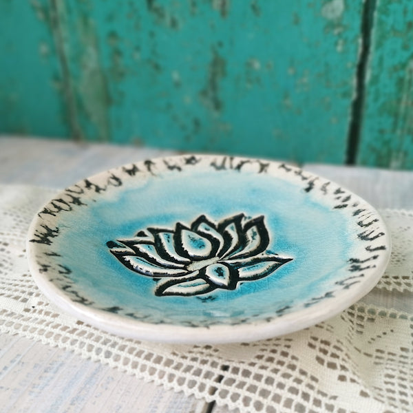 Turquoise ceramic bowl with lotus flower pattern