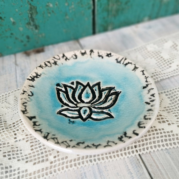 Turquoise ceramic bowl with lotus flower pattern
