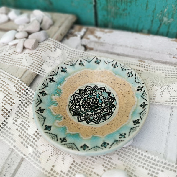 Honey brown and turquoise ceramic bowl with mandala pattern