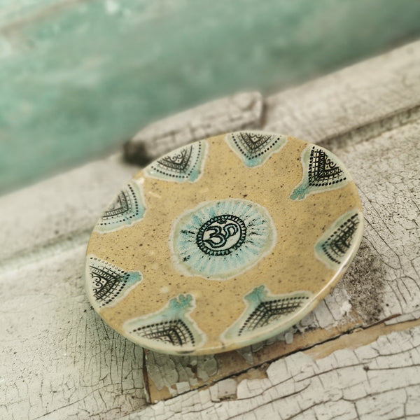 Honey brown ceramic bowl with ohm symbol
