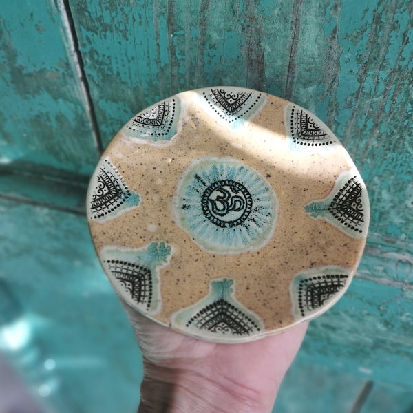 Honey brown ceramic bowl with ohm symbol