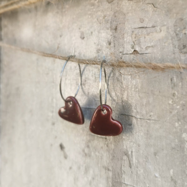 Handmade colorful hearts in burgundy color