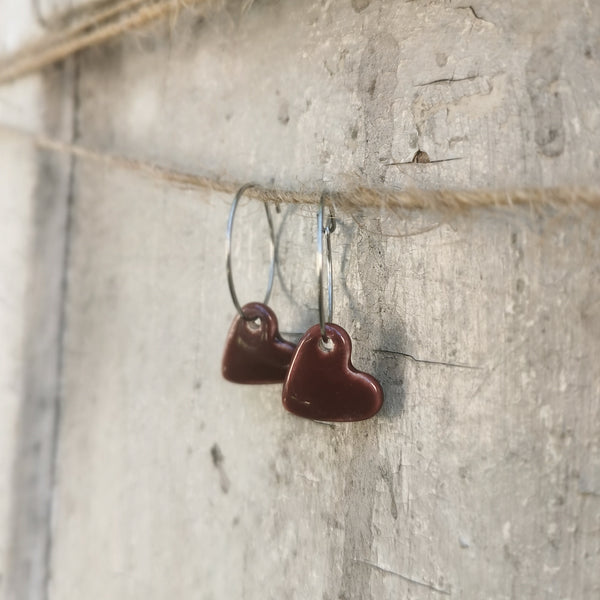 Handmade colorful hearts in burgundy color