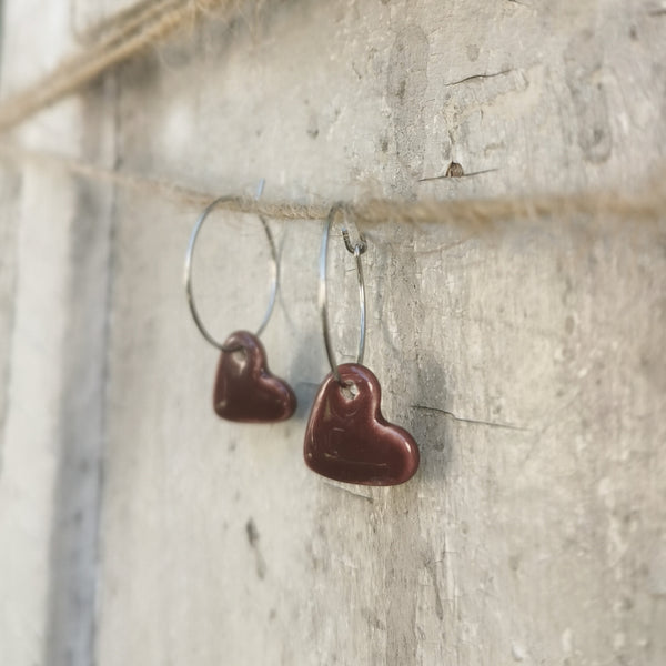 Handmade colorful hearts in burgundy color
