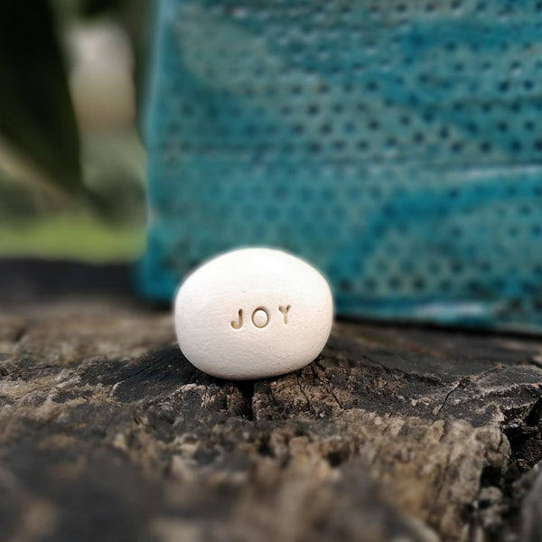 JOY - Motivational message ceramic pebble